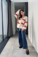 Beżowy sweter z kolorowymi frędzlami
