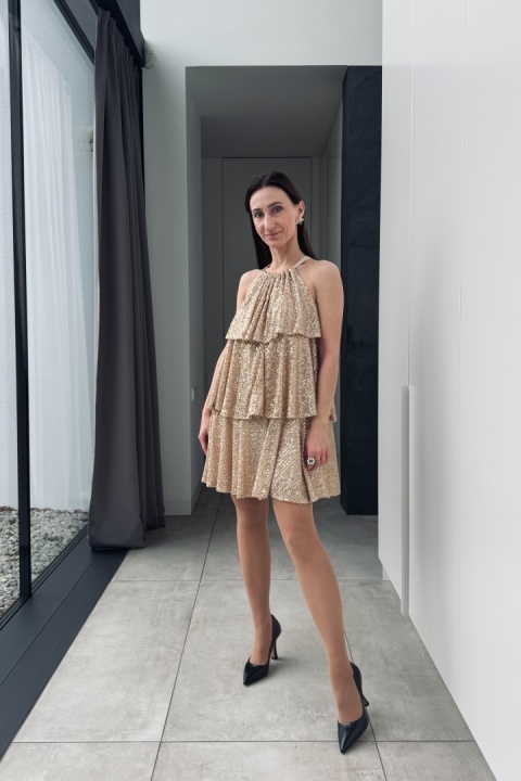 Zwiewna sukienka z cekinami, z kokardą z tyłu | złota