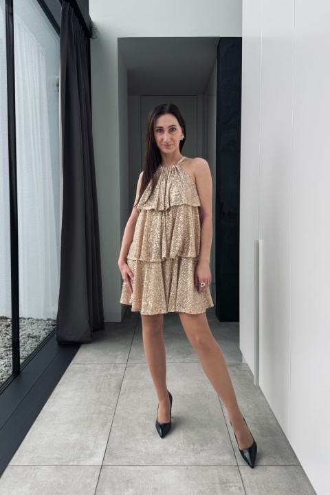 Zwiewna sukienka z cekinami, z kokardą z tyłu | złota